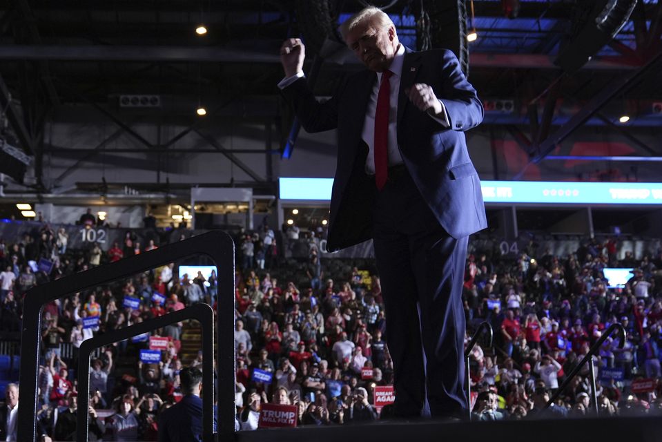 Republican presidential nominee Donald Trump dances during a campaign rally at Santander Arena in Reading, Pennsylvania (Evan Vucci/AP)