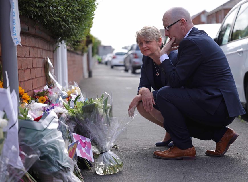 Home Secretary Yvette Cooper looks at tributes near the scene in Hart Street where three children died and nine were injured in a knife attack (James Speakman/PA)