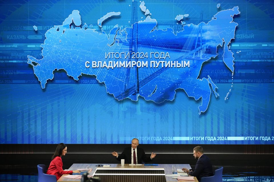 Russian President Vladimir Putin speaks during his annual news conference (Alexander Zemlianichenko/AP)