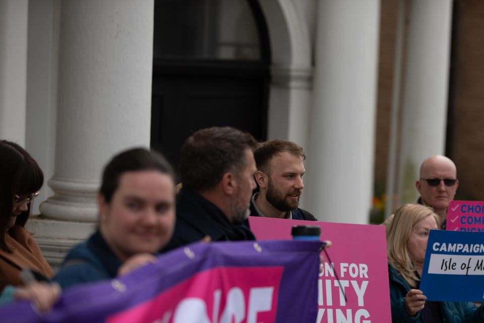 Supporters of the Assisted Dying Bill gathering outside Tynwald, the Isle of Man’s parliament (Lee Notman/PA)