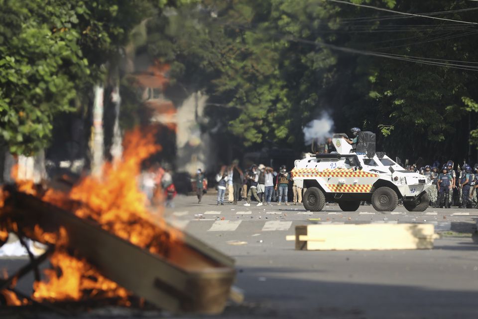 Police fire tear gas shells and rubber bullets to disperse students in Dhaka, Bangladesh, this week (Rajib Dhar/AP)