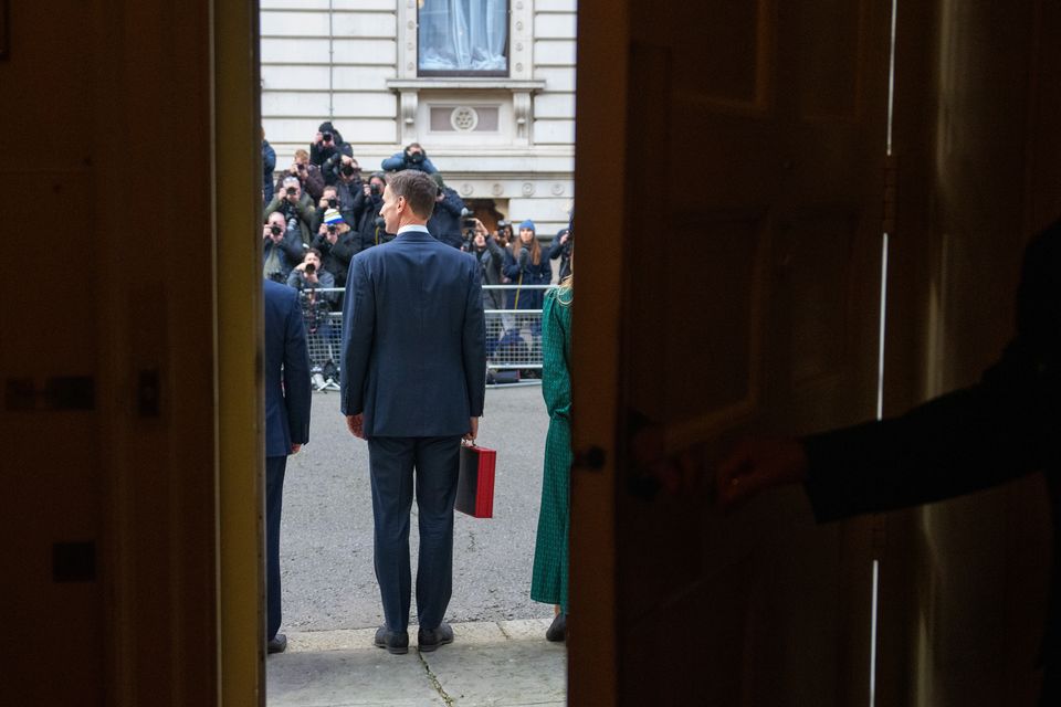 Then chancellor Jeremy Hunt stands outside 11 Downing Street, London, to face the media with his ministerial box, before delivering his budget in March (Carl Court/PA)