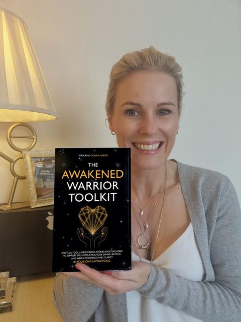 Donna with her book collaboration, The Awakened Warrior Toolkit
