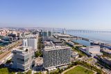 thumbnail: An aerial view of the Park of Nations with the Martinhal Oriente in the foreground, and the Vasco da Gama bridge in the distance