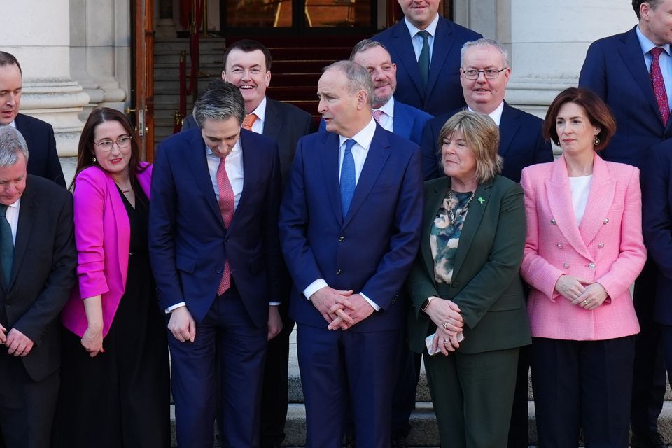 Taoiseach Micheal Martin and Tanaiste Simon Harris with newly appointed ministers (Brian Lawless/PA)