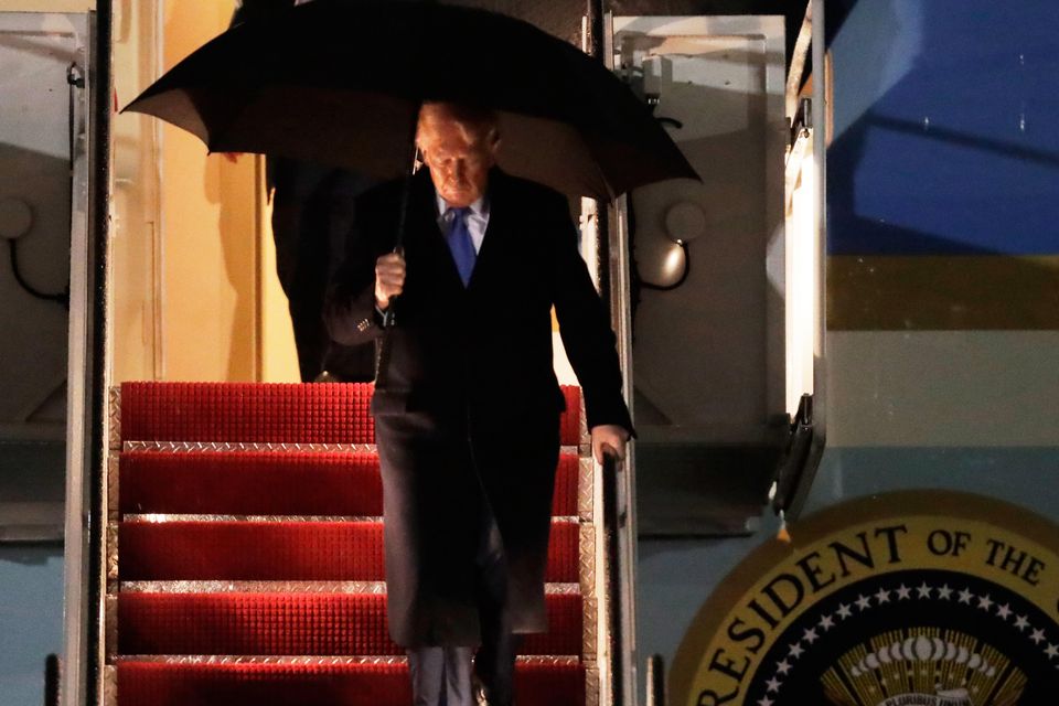 President Donald Trump walks down the stairs of Air Force One upon his arrival at Joint Base Andrews, Maryland (Luis M Alvarez/AP)