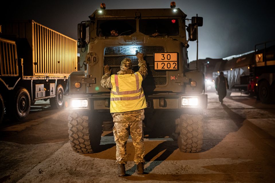 British military vehicles are inspected as they arrive at the military base at Szentes (Ben Birchall/PA)