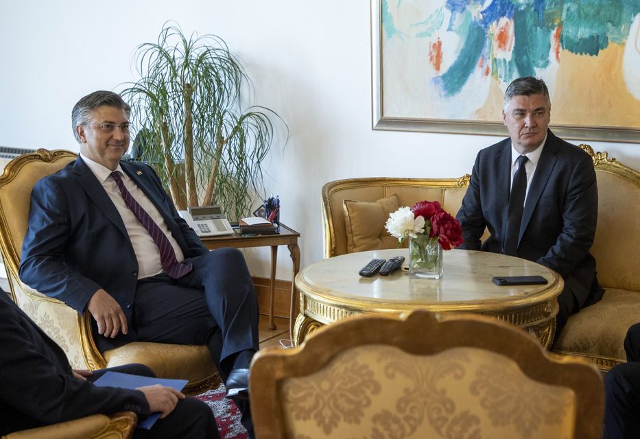 Andrej Plenkovic, left, meets President Zoran Milanovic at the presidential palace in Zagreb, Croatia, on Friday (AP)