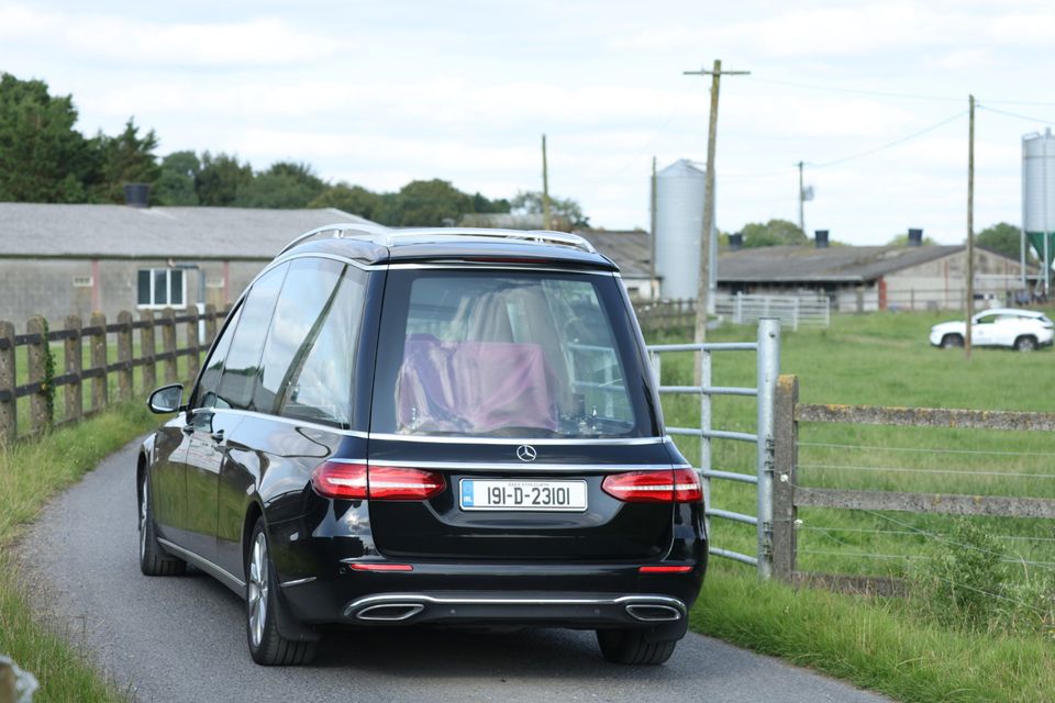 A hearse arrives at the crash site in Killucan, Westmeath. Photo: Collins.