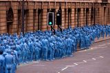 thumbnail: Naked volunteers, painted in blue to reflect the colours found in Marine paintings in Hull's Ferens Art Gallery, prepare to participate in US artist, Spencer Tunick's "Sea of Hull" installation in Kingston upon Hull on July 9, 2016. AFP/Getty Images