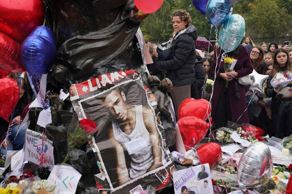 Floral tributes were left as people attended a vigil for 31-year-old One Direction singer Liam Payne at Hyde Park in central London (Jonathan Brady/PA)