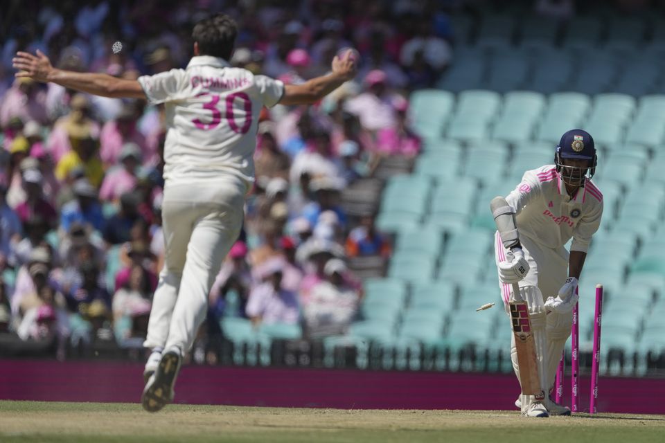 India’s Washington Sundar is bowled by Australia’s captain Pat Cummins (Mark Baker/AP)