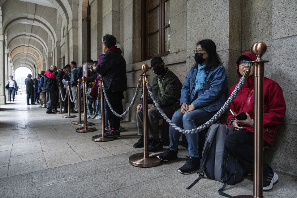 People wait in line outside the Court of Final Appeal in Hong Kong (Chan Long Hei/AP)