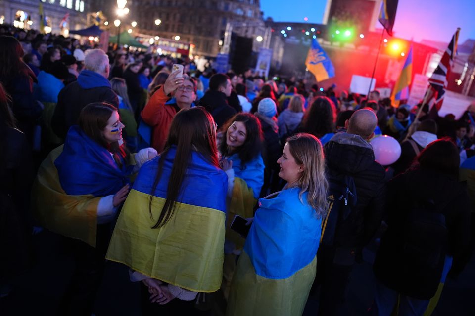 People gather in Trafalgar Square, central London, to mark the third anniversary of Russia’s invasion (Aaron Chown/PA)