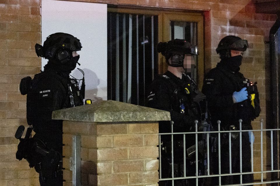 Armed response officers attend a property in Ross Road in west Belfast where a man fell from a roof on February 8 (Photo by Kevin Scott/Belfast Telegraph)