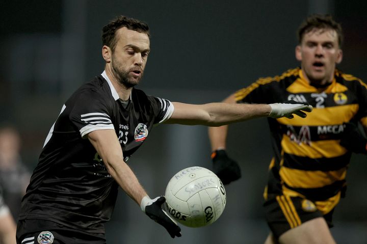 Down chief Conor Laverty the standard-bearer for Kilcoo stars, beams Karl Lacey