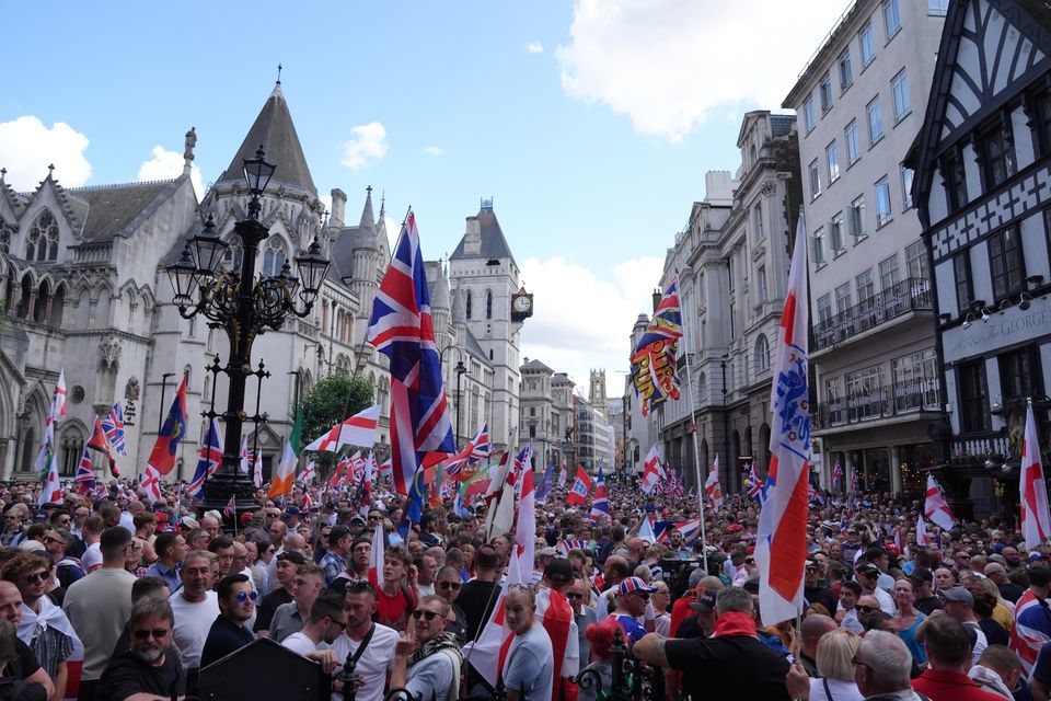 People take part in a protest march in central London organised by Tommy Robinson (Maja Smiejkowska/PA)