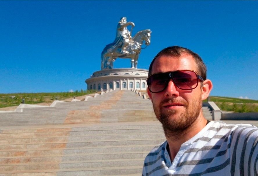 Patrick in front of a Genghis Khan statue in Mongolia