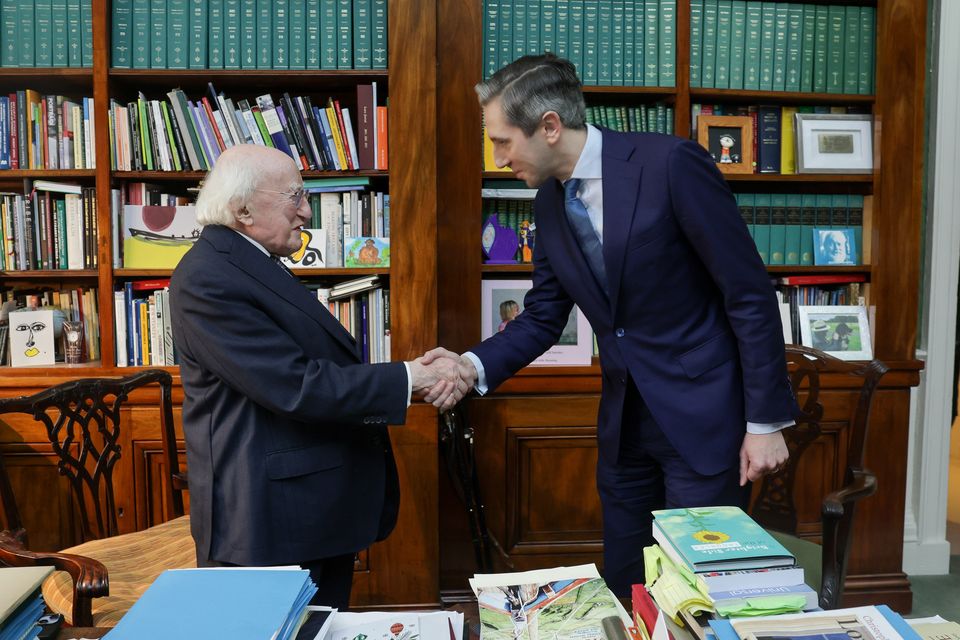 Irish President Michael D Higgins with Simon Harris in Aras an Uachtarain where he formally tendered his resignation as Taoiseach (Maxwells/PA)