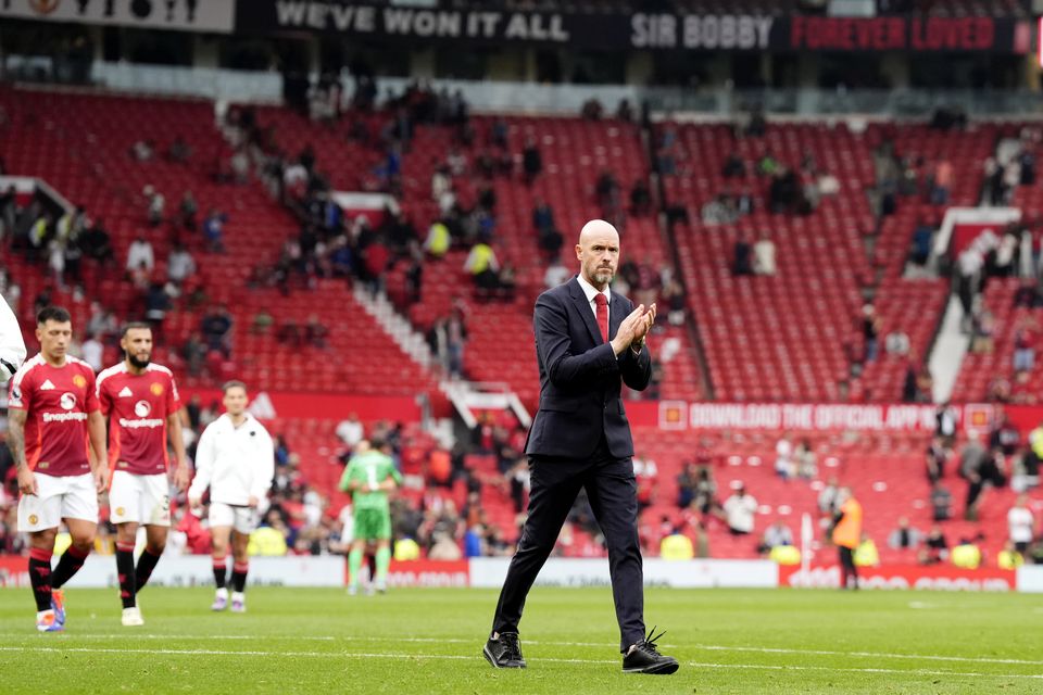 Erik ten Hag applauds the remaining fans as Old Trafford quickly empties at the end of this season’s 3-0 defeat to Liverpool (Nick Potts/PA)