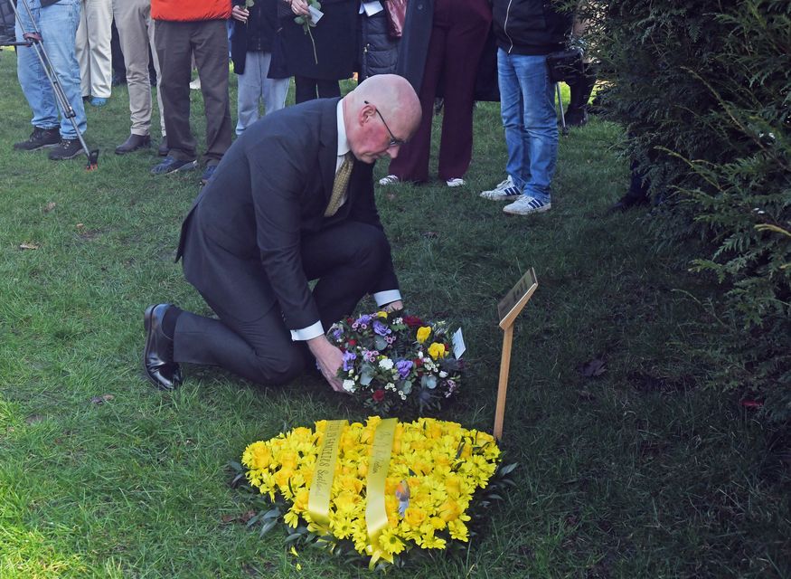 First Minister of Scotland John Swinney lays a wreath during the Covid-19 Day of Reflection (Mike Boyd/PA)