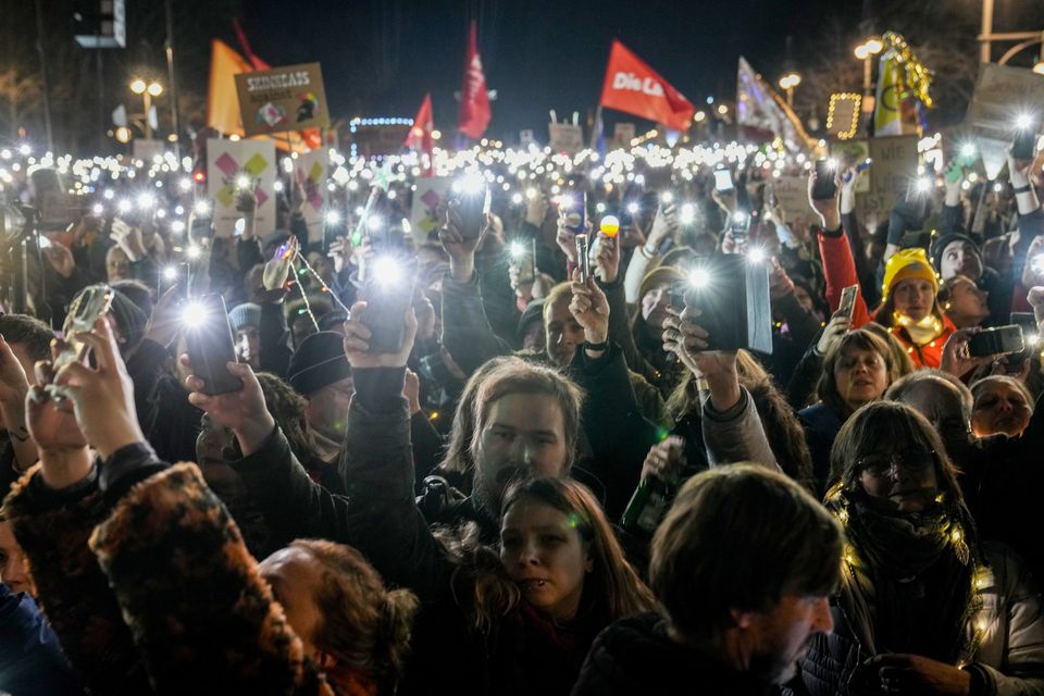 Phones were lit up in protest against the far-right (AP)