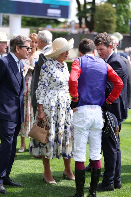 Queen Camilla (centre) with jockey Oisin Murphy, rider of her horse Handcuffed, in the Sodexo Live! Princess Margaret Stakes (Fillies’ Group 3), during the Qipco King George Day at Ascot Racecourse, Berkshire (Steven Paston/PA)