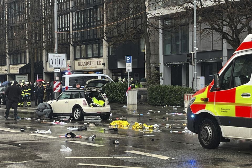 Emergency services attend the scene of an accident after a car hit a group of people in Munich, Germany (Christoph Trost/dpa via AP)