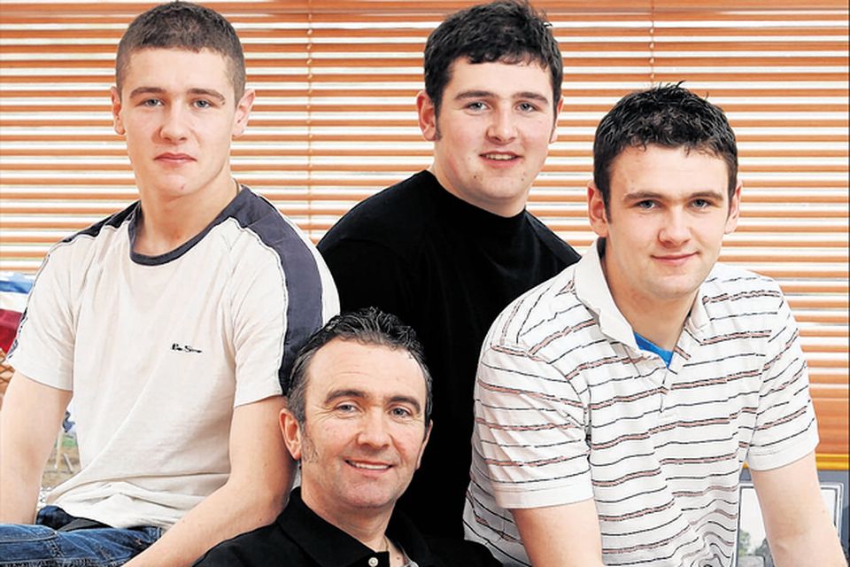 Robert Dunlop in a picture taken shortly before his death with (from left) sons Daniel, Michael and William