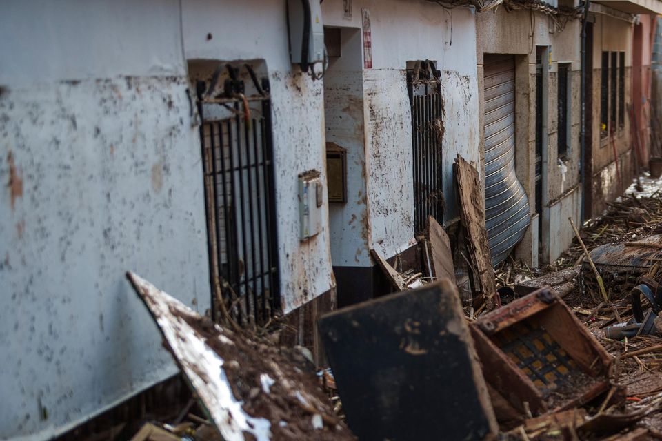 A street covered with mud and debris in Valencia (Manu Fernandez/AP/PA)