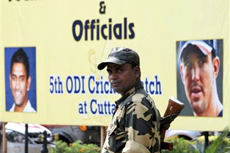An Indian security person stands outside a hotel where the cricket teams of England and India are staying in Bhubaneswar, India, Thursday, Nov. 27, 2008. The remainder of England's limited-overs cricket tour of India has been scrapped and a Champions League Twenty20 tournament scheduled for next week is in doubt following terror attacks in Mumbai.(AP Photo/Biswaranjan Rout)