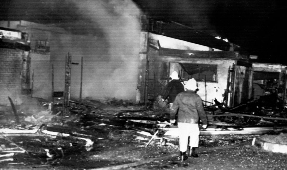 Firemen searching through the rubble at the wrecked La Mon House restaurant near Belfast (PA Archive)