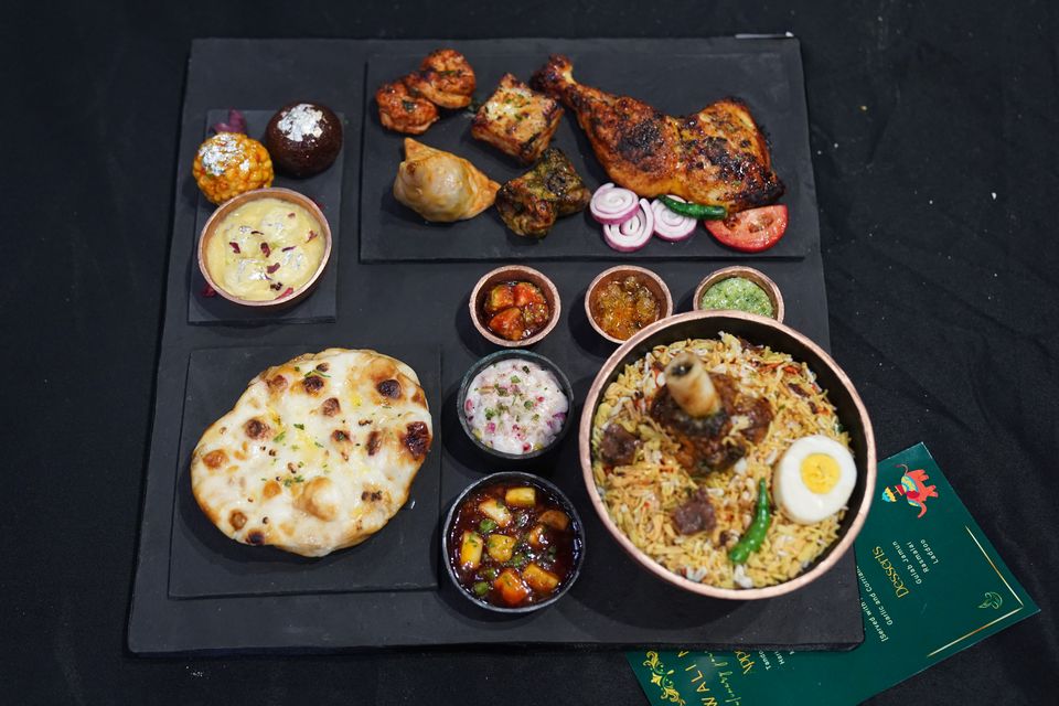 A cake depicting a selection of dishes from an Indian takeaway (Jacob King/PA)