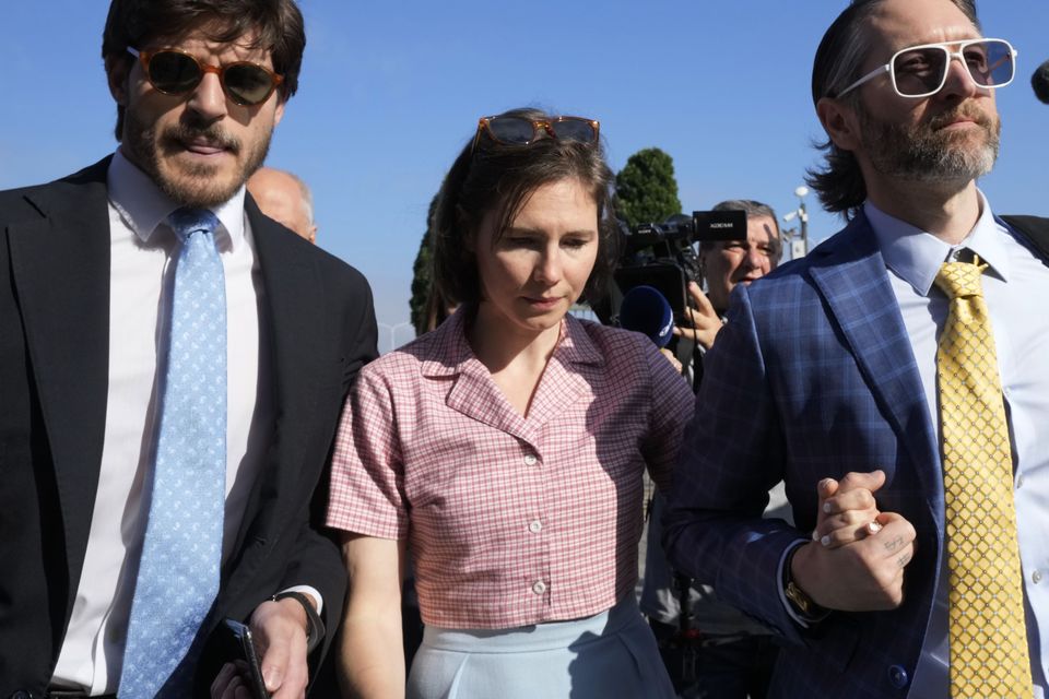 Amanda Knox arrives with her husband Christopher Robinson, right, at a Florence courtroom on June 5 (Antonio Calanni/AP)