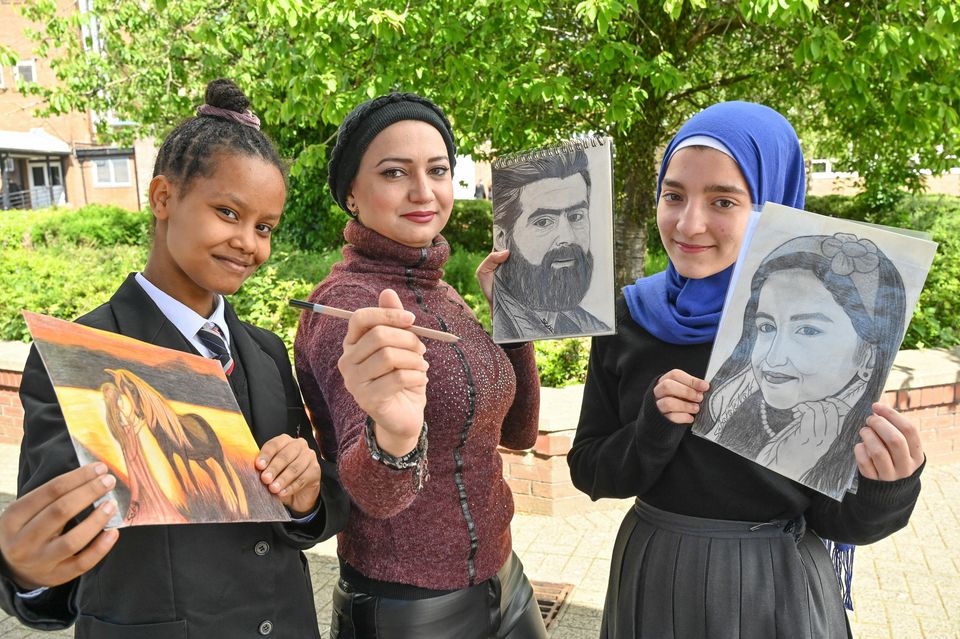 Seba (centre) and pupils Hanna Nuguse and Shahed Karmach show off their work