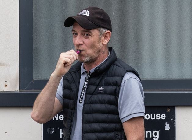 A noisy neighbour who shouted about blast bombs and sang loyalist songs while hanging out of a broken window during a bizarre Twelfth celebration has avoided jail.