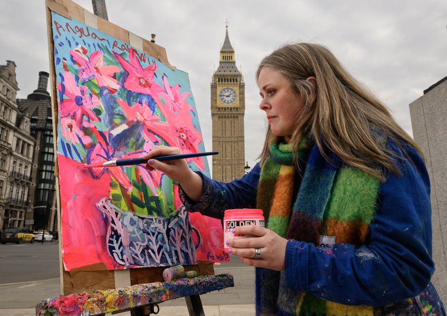 Emily Powell working on her ‘Angela Raylily (Angela Rayner)’ artwork (Doug Peters/PA)