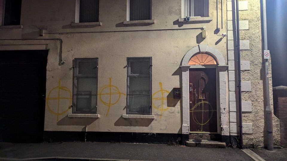 Graffiti daubed on wall during race-hate attack on a mosque in Newtownards.