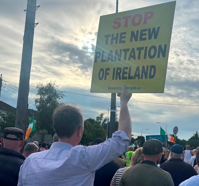 Protesters take part in a demonstration in Coolock, north Dublin, on Friday evening. Photo: PA