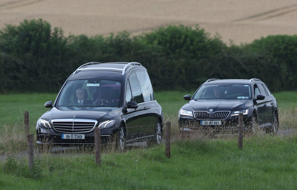 A hearse leaves the crash scene (Damien Eagers/PA)