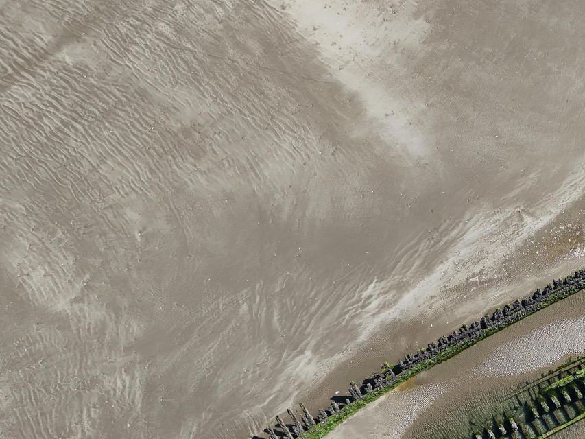 A shipwreck on the Cefn Sidan beach at Pembrey Country Park in Carmarthenshire, South Wales (David Davies/PA)