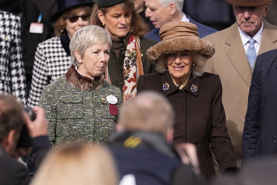 Camilla was escorted by Sybil Ruscoe on day two of the 2025 Cheltenham Festival (Andrew Matthews/PA)