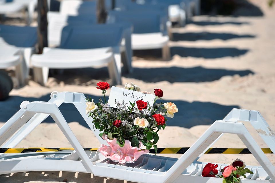 SOUSSE, TUNISIA - JUNE 27:  Flowers are placed at the beach next to the Imperial Marhaba Hotel where 38 people were killed yesterday in a terrorist attack on June 27, 2015 in Souuse,Tunisia. Habib Essid Prime Minister of Tunisia  announced a clampdown on security after the attack on a holiday resort..  (Photo by Jeff J Mitchell/Getty Images)