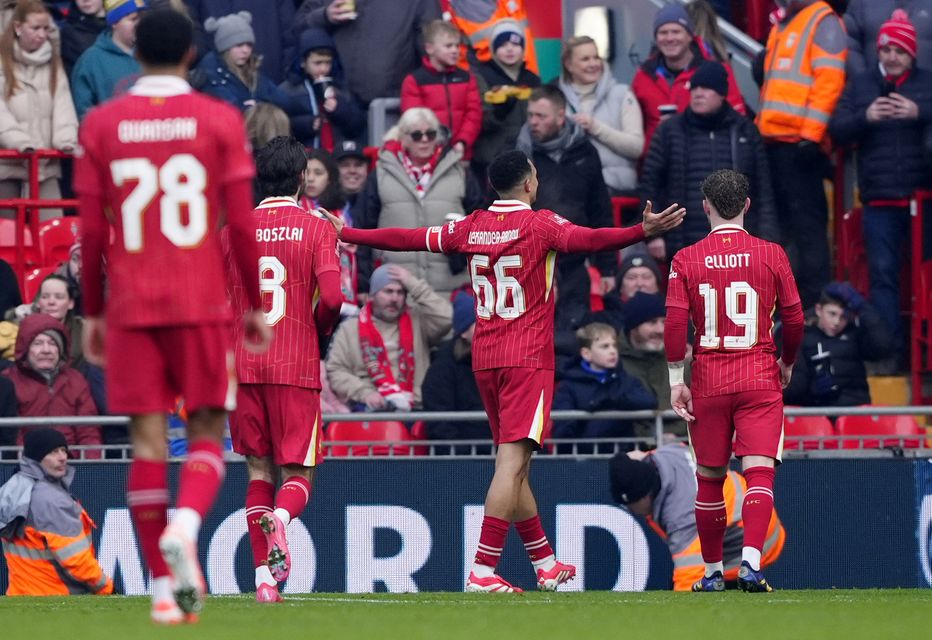 Trent Alexander-Arnold, centre, celebrates scoring in Liverpool’s win over Accrington (Peter Byrne/PA)