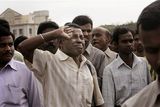 thumbnail: A mourner gives a final emotional salute during the funeral of Hemant Karkare, the chief of Mumbai's Anti-Terrorist Squad who was killed by gunmen, in Mumbai, India, Saturday, Nov. 29, 2008. Indian commandos killed the last remaining gunmen holed up at a luxury Mumbai hotel Saturday, ending a 60-hour rampage through India's financial capital by suspected Islamic militants that killed people and rocked the nation. (AP Photo/Rajanish Kakade)