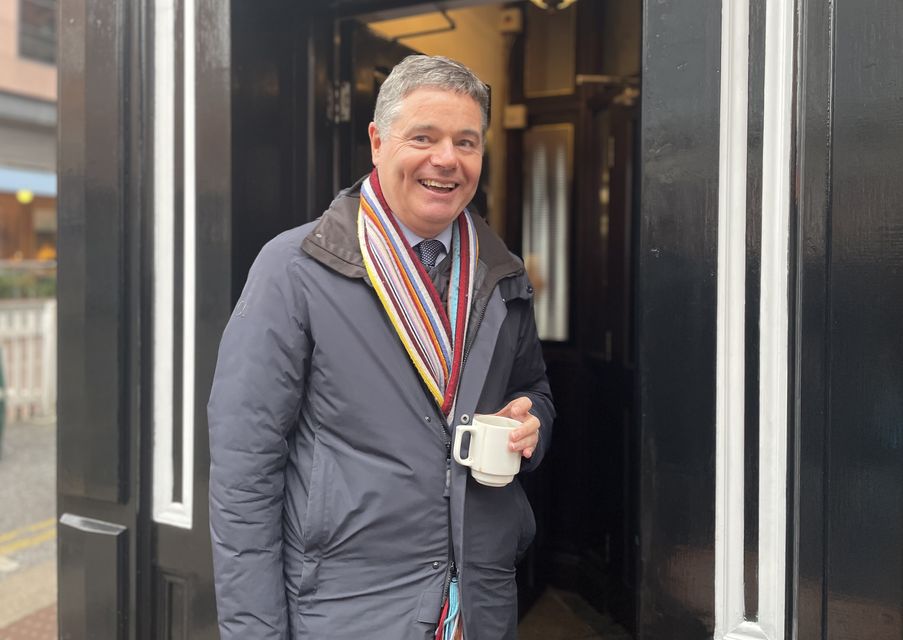 Minister Paschal Donohoe grabs a coffee in The Boar’s Head on Capel Street, Dublin (Grainne Ni Aodha/PA)