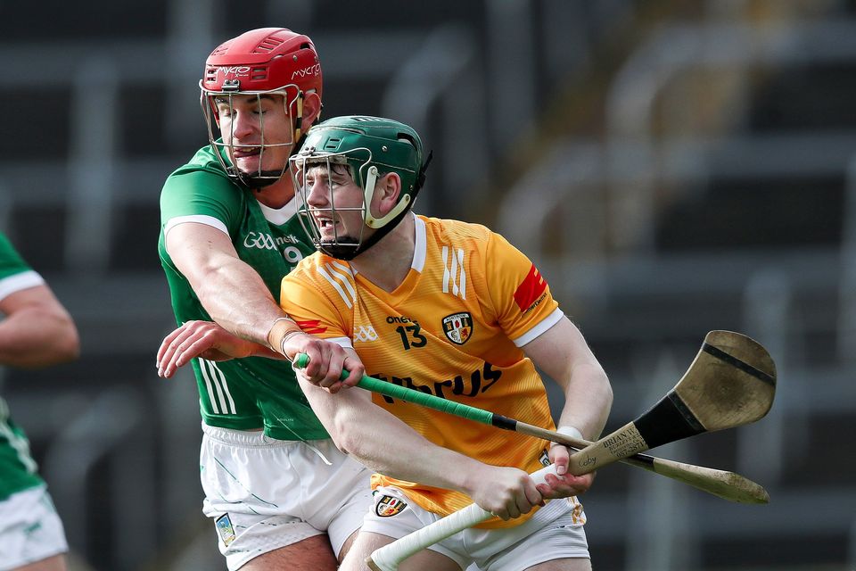Limerick's Colin Coughlan tackles Conal Cunning of Antrim