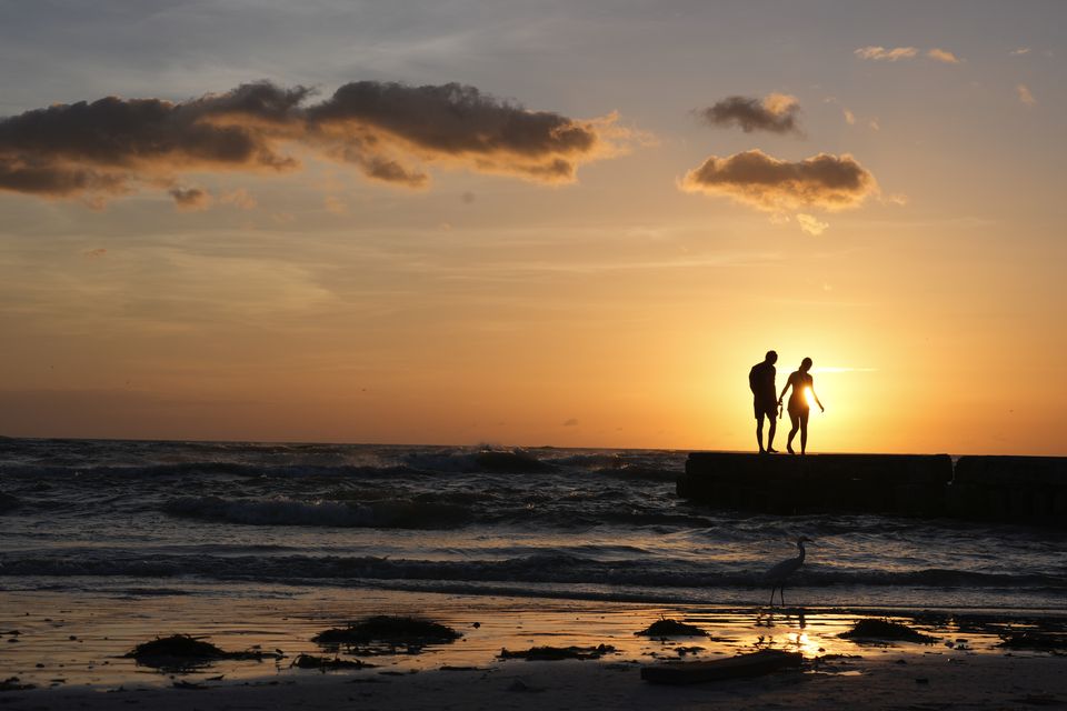 People from Sarasota, Florida visit a beach on Siesta Key (Rebecca Blackwell/AP)