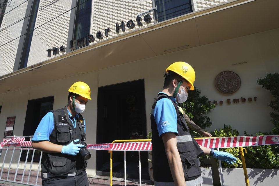 Police forensics team arrive at a hotel in Bangkok (AP/Sakchai Lalit)