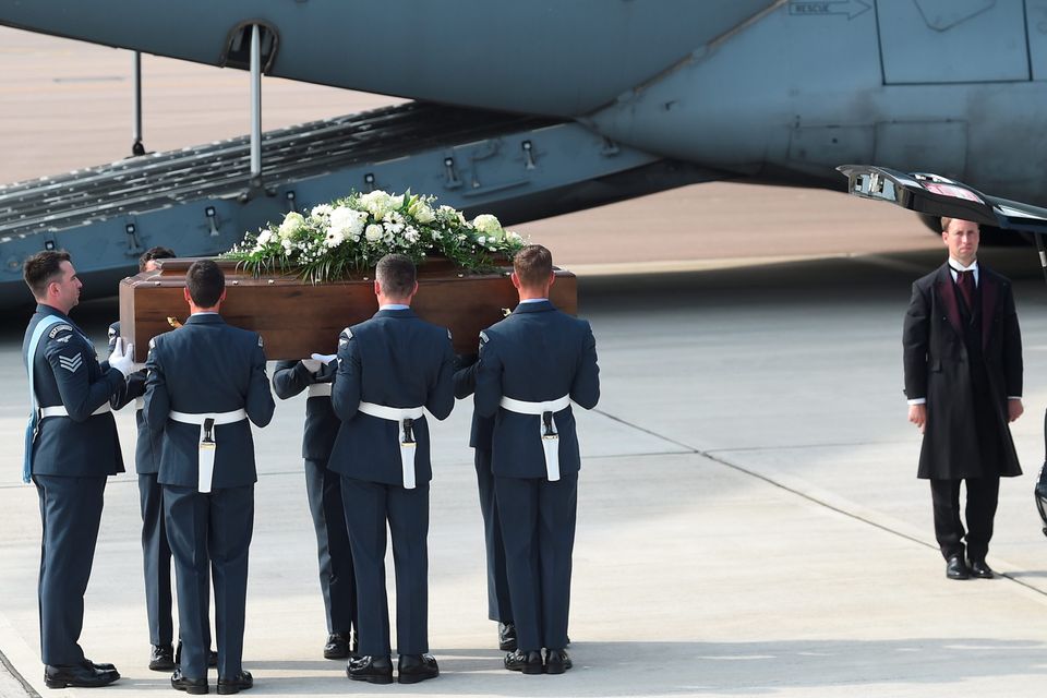 BRIZE NORTON, ENGLAND - JULY 01:  The coffin of Denis Thwaites, one of the victims of last Friday's terrorist attack, is taken from the RAF C-17 aircraft at RAF Brize Norton in Tunisia, on July 1, 2015 in Brize Norton, England. British nationals Adrian Evans, Charles Evans, Joel Richards, Carly Lovett, Stephen Mellor, John Stollery, and Denis and Elaine Thwaites are the first of the victims of last week's terror attack to be repatriated.  (Photo by Joe Giddens-WPA Pool/Getty Images)